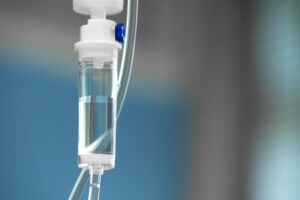 IV sedation equipment with clear fluid, illustrating intravenous sedation for dental procedures to alleviate anxiety.